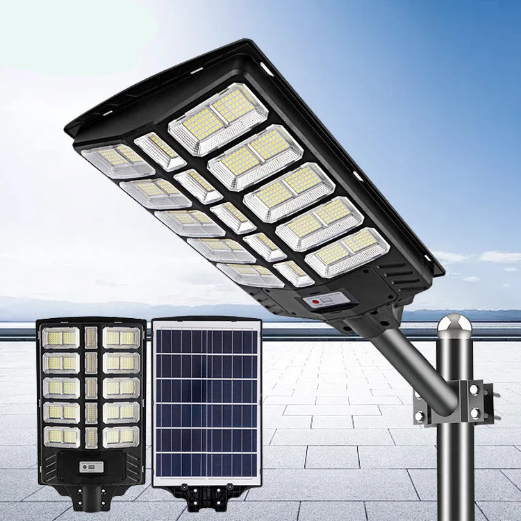 Lampe Solaire Extérieure -  800 Watts, Couleur 6000K - Angle 150x70° - IP65 - Dimensions 70 x 30 x 8 cm - Tube d'Insertion 45mm - Avec Détecteur de Mouvement et Télécommande - 3 Modes - Mouvement, IP65 Imperméable pour Rue et Garage